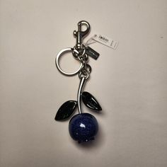 Coach Glitter Blueberry Bag Charm Silver/Light Violet Multi Style Number * Cr434 Measurements * Length: 2.25" * Height: 6.0" * Width: 1.25" Materials * Resin And Metal Features * Attached Split Key Ring And Dogleash Clip Fruit Bag, Light Violet, Blueberry Fruit, Keychain Fob, Silver Lights, Funky Jewelry