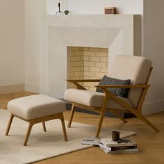 a chair and ottoman in front of a fireplace