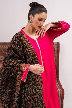 A shocking pink raw silk suit highlighted with embroidered motifs on the sleeves and with matching Kashmiri machine embroidery on the black velvet shawl.3-piece suitReady-to-wear Formal Pink Embroidered Dupatta, Pink Lawn Suit With Resham Embroidery For Formal Occasions, Pink Lawn Suit With Resham Embroidery For Formal Events, Pink Formal Salwar Kameez With Dabka, Traditional Pink Lawn Suit For Formal Occasions, Formal Pink Kurta With Dupatta, Formal Pink Lawn Suit With Dupatta, Pink Silk Traditional Wear For Formal Occasions, Formal Pink Traditional Wear With Dupatta