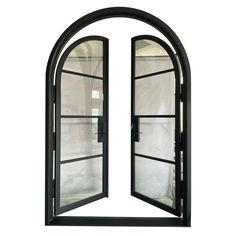 an arched window with glass and metal bars on the bottom, in front of a white background