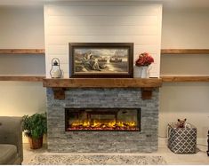 a living room with a fire place in the center and shelves on either side of the fireplace