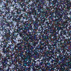 an image of many colored confetti sprinkles