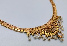 "22 k solid gold and pearl beads necklace choker from rajasthan india. detailed handcrafted, great piece for any collection. total length-15\"(we can adjust length), width of center-2.4 cm(inc. dangles), weight-17 grams. material-solid 22 k gold." Traditional Kundan Pearl Necklace In Yellow Gold, Traditional Yellow Gold Kundan Pearl Necklace, Gold Pearl Necklace With Intricate Design For Diwali, Diwali Gold Pearl Necklace With Intricate Design, 22k Gold Pearl Necklace For Diwali, Traditional Gold Kundan Pearl Necklace, Gold Bollywood Pearl Necklace For Festive Occasions, Traditional Kundan Gold Pearl Necklace, Ceremonial Gold Pearl Necklace In Temple Jewelry Style