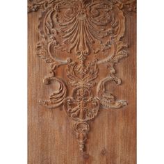 an old wooden door with carvings on it