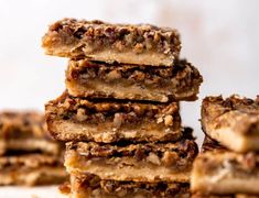 a stack of pecan bars stacked on top of each other