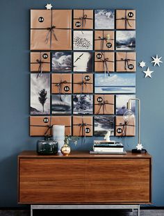 a wooden dresser topped with lots of pictures next to a wall mounted on it's side