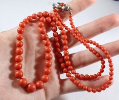 -Antique Sterling Silver Natural Red Orange Coral Beaded Necklace -Total length: 20.5 in -Coral size: 3.4 mm ~ 8.2 mm -Coral on clasp size: 3.75 mm -Total weight: 18.3 g -Marked 835 -The coral beads have small holes in them but they are naturally formed, there's also a little big of chip Elegant Red Coral Jewelry With 8mm Beads, Classic Red Coral Formal Jewelry, Elegant Orange Jewelry With 8mm Beads, Classic Red Hand-strung Jewelry, Coral Beads Necklace, Orange Coral, Coral Beads, New City, Beaded Necklaces