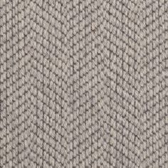 an up close shot of the texture of a tweed fabric, which is grey and white