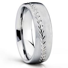 a wedding ring with engraved leaves on the side and an engraving pattern in white gold