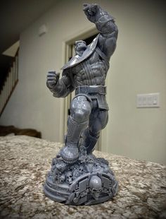 a statue of a man in armor on a counter