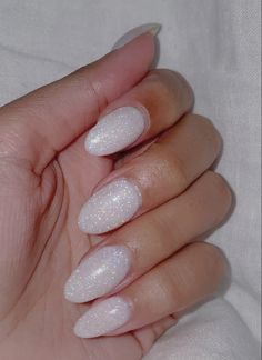 Basic Sparkly Nails, Simple White Sparkle Nails, Rounded Glitter Nails, White Frost Nails, White Sparkly Nails Almond, White Shimmer Almond Nails, White Fairy Dust Nails, Neutral Nails Sparkle, Milky White Prom Nails