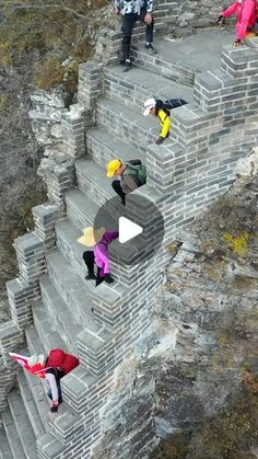 several people walking up and down some stairs