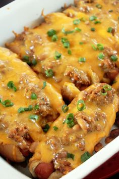 a casserole dish with meat, cheese and green onions