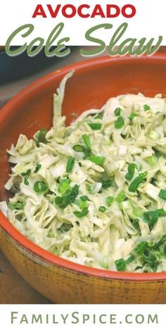 an orange bowl filled with coleslaw and garnished with scallions