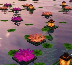 several floating plants in the water with lanterns on them and some flowers growing out of them