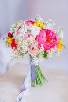 a bouquet of colorful flowers on a table