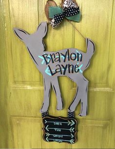 a door hanger with a deer and bow on it's head that says branton lane