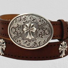 Ariat Ladies Rich Tan Colored Leather Strap Belt This Ladies Ariat Belt By M&F Western Products Is Perfect To Pair With Your Favorite Jeans. It Features A Brown Strap With Perforated Edges And Cross Conchos Down The Center. Its Neutral Colors Will Go With So Much In Your Wardrobe. It Also Comes With A Beautiful Oval Western Etched Buckle With A Center Cross. Ariat Ladies Belt 1-1/2” 48" Tan Rich Tan Colored Leather Strap Perforated Edges Antiqued Silver Color Cross Conchos Floral Detailed Silver Elegant Silver Leather Belt Buckles, Classic Concho Belt Buckles, Silver Leather Concho Belt Buckles, Vintage Silver Leather Belt Buckles, Ariat Belts, Ladies Belt, Cowgirl Belts, Turquoise Belt, Bling Belts