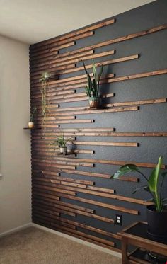 a living room with some plants on the wall and a video screen showing how to use it