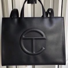 Brand: Telfar Color: Black Size: Medium Condition: Brand New Worn Once!! Tag Is Still On! Telfar Medium Bag, Medium Telfar, Telfar Black, Black Shopping Bag, Telfar Bags, Branded Shopping Bags, Telfar Bag, Trendy Purses, Brown Tote Bag