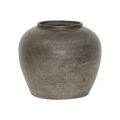 a gray vase sitting on top of a white background