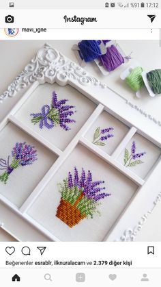 an embroidered picture frame with lavender flowers on it