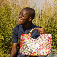 Treat the world as your personal runway with our one-of-a-kind, woven handbags made with sustainable rattan handles. Handmade from 100% upcycled materials and designed with 100% heart. *Every one of our bags are one-of-a-kind. This one you have selected (shown in first image) is 100% unique and is the exact one we'll send to you. Product Details Open top (no zipper) Soft and smooth to the touch, yet incredibly strong Double weave with 5-year warranty Handle made with sustainably sourced rattan R Eco Friendly Handbags, Earth Bag, Handbags Handmade, Multi Colored Bag, Layered Weave, Silver Handbag, Sustainable Accessories, Colorful Handbags, Double Weave