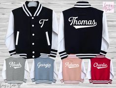 Looking for the perfect personalised custom kids varsity jacket? Our supersoft, college baseball children's varsity jacket is the ultimate blend of style and comfort. With its letterman style design, it's a must-have for kids, toddlers and babies alike.  Featuring a name on the back and initial on the front, our jacket allows you to add a personal touch that your child will love. It's the ideal birthday, new baby, or Christmas gift. Plus, with the option to match siblings, you can create adorabl Customizable Varsity Baseball Jersey, Fall School Varsity Jacket With Letter Print, Fall Letter Print Varsity Jacket For School, Varsity Letter Print Baseball Jersey For College, Varsity Baseball Jersey With Letter Print For College, School Varsity Jacket With Ribbed Cuffs, College Style Varsity Jacket With Baseball Collar, College Varsity Jacket With Letter Embroidery, White Varsity Jacket With Team Name For Sports Events