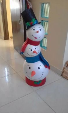 three snowmen are stacked on top of each other