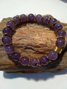 Women's Amethyst Beaded Bracelet With Tibetan Gold Bead Accents Make a Beautiful Stunning Piece of Jewelry Bracelet Homemade, Homemade Bracelet, Amethyst Beaded Bracelet, Beading Designs, Amethyst Bracelet Beads, Homemade Bracelets, Purple Fits, Bracelets Design, Purple Bracelet