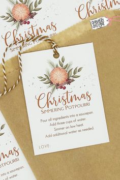 three brown envelopes with christmas cards on them