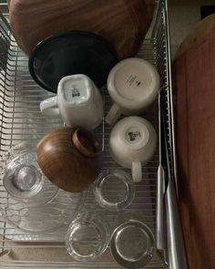 pots and pans sitting on top of a metal rack