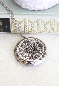 This is a large round locket necklace with lacy floral etched designs! This beautifully detailed locket in antiqued silver brass is a romantic Round Locket Necklace, Pear Shaped Diamond Necklace, Timeless Necklace, Silver Locket Necklace, Picture Locket, Diamond Initial Necklace, Gold Letter Necklace, Round Locket, Romantic Gifts For Her