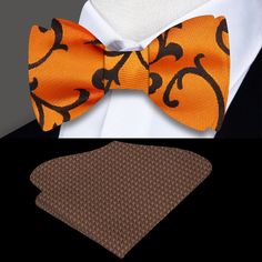 Orange and Brown Floral Self-Tie Bow Tie Close your eyes and imagine a luxurious silk bow tie in a bright orange and brown floral pattern. The intricate design of the floral pattern is captivating, with bursts of bright orange petals that seem to dance against a rich brown backdrop. The smoothness and sheen of the silk give the tie a sense of luxury and sophistication. Pair this bow tie with a crisp white dress shirt to create a classic and timeless look. The white shirt will provide the perfect Formal Orange Bow Tie, Brown Backdrop, Tie Matching, White Dress Shirt, Silk Bow Ties, Navy Blue Suit, Silk Bow, Brown Suits, Light Blue Shirts