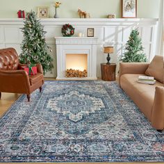 a living room filled with furniture and a fire place in the middle of the room