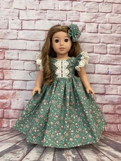 Such an adorable dress in green with peach floral and vintage lace trim. Comes with matching floral hair clip ( button used may vary). Made for 18 inch dolls such as American Girl. Doll Fancy Dress, Vintage Doll Dress, Goddess Outfit, Fairy Outfit, American Girl Crafts, Girl Crafts, Floral Hair Clip, Fairy Dresses, Fairy Clothes