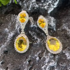 ✰ 2 shiny yellow cz gemstones makes the drop earring with halo more sparkly and graceful  ✰ This delicate lab-created handmade gemstone dangle earrings is perfect for people who want to achieve a brilliant and splendid look ✰ This yellow earrings dangle not only suitable for formal occasions such as banquets, weddings, theme parties, but also for everyday wear ✰ This dangle earrings wedding is a very special gift for birthday, Mother's Day, Valentine's Day and more  ✰ Comes with an exquisite gift box We also offer the ring and necklace from the same collection: https://www.etsy.com/listing/1236503255/yellow-zircon-ring-with-halo-yellow-oval https://www.etsy.com/listing/1220589212/oval-zirconia-necklace-perfect-birthday Materials: Environmentally-friendly copper Needle Materials: Silver Qua Earring Bridal, Dangle Earrings Wedding, Cheap Rings, Zirconia Necklace, Earring Silver, Cubic Zirconia Jewelry, Theme Parties, Yellow Earrings, Zircon Ring