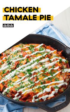 chicken tamale pie in a cast iron skillet on a blue towel with text overlay