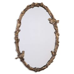 an oval mirror with birds on it and branches around the edges, against a white background