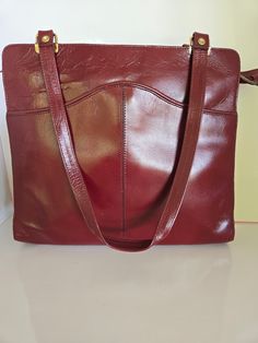 Gorgeous vibrant burgundy leather shoulder bag. The color on this bag is amazing.  The quality is awesome very little wear if any. Check this bag out on my YouTube channel at  Bag Size 11 inches wide by 10 1/2 inches tall, 9 1/2 inch strap drop. 8/10 Condition My Youtube Channel, 11 Inches, Youtube Channel, Purses And Handbags, Labour Day, Leather Shoulder Bag, Shoulder Bags, 1960s, Bathing Beauties