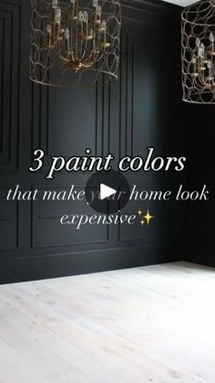 an empty room with black walls and chandelier hanging from the ceiling that says 3 paint colors that make your home look expensive