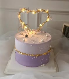 there is a cake that has been decorated with lights