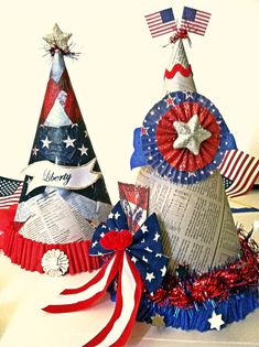 two patriotic hats made out of newspaper strips