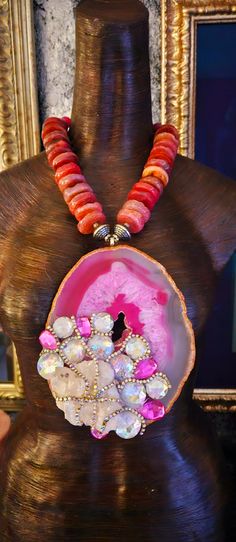 After a re-stringing repair, this piece is now ready for a new home! A 7" x 5" hot pink and Fuchsia Brazilian agate hosts a rough white quartz cluster, faux clear and pink crystals and rows of silver aurora borealis rhinestones! The pendant is suspended from an agate rondelle statement necklace which measures 21". The reddish-pink agates are polished on one side and rough on the other. Each agate is spaced with an ornate silver tone metal bead. Flanking the pendant are rhinestone rondelles and silver tone stamped tribal bi-cone beads. The back is finished with more tribal beads, rhinestone rondelles, frosted pink druzy agates and clear faceted crystals. Closes with a fancy silver tone hook and eye. This is a very dense and heavy piece so please know your tolerance before you buy. From the Rocker Chic Accessories, Statement Necklace Wedding, Brazilian Agate, Unique Pendant Necklace, Metal Bead, Chest Piece, Mermaid Necklace, Pink Agate, Red Agate