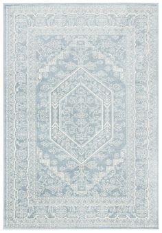 a blue and white rug with an intricate design