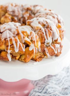 a close up of a cake on a plate with icing drizzled