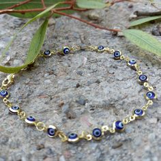 Round Evil Eye Beads Bracelet, made of high-quality 14k gold filled chain. Elegant&dainty, catching gently everyone's attention. Appropriate either for everyday or formal looks. Also available in 925 Sterling Silver. Find similar bracelet here: https://www.etsy.com/listing/1291361193/silver-bracelet-with-murano-evil-eye?click_key=8f8fe70f60610a4c38c6c14ed24c3b9a45f7d846%3A1291361193&click_sum=a2a64bfe&ref=shop_home_active_3&pro=1&frs=1 Length approx. 6.2 inches / 16 cm - can be adjusted upon req Elegant Evil Eye Bracelet With Round Beads, Elegant Evil Eye Bracelets With Round Beads, Dainty Blue Bracelet With Adjustable Chain, Dainty Blue Round Bead Bracelets, 14k Gold Chain Bracelet With Round Beads Gift, 14k Gold Chain Bracelet With Round Beads, Dainty Blue Bangle Jewelry, Dainty Blue Bangle, Blue Evil Eye Bracelet With Tiny Beads For Gift