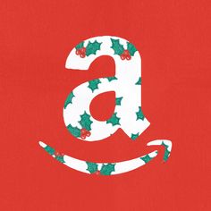 the letter b is made up of holly leaves and red berries on a red background