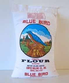 a blue bird flour bag sitting on top of a table