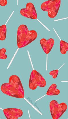 many red hearts and lollipops are on a blue background with white pins